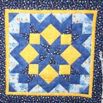 Miniature
Second Place
Entered by:	Sheryl Abdill
	Clovis,  NM
Made by:	Sheryl Abdill
Quilted by: 	Sheryl Abdill
Pattern by:  Janet Nesbitt & Pam Soliday
Size: 	8.5 x 8.5
Quilters Don't Throw Away Anything!
