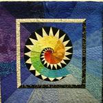 Wall Quilt Amateur
Honorable Mention
Entered by:	Joan Bechtel
	Midland,  TX
Made by:	Joan Bechtel
Quilted by: 	Joan Bechtel
Pattern by:  Barbara Olson
Size: 	28.5 x 28.5
Fire and Ice
