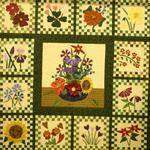 Mixed Technique Two Person/Group Quilt Large
Second Place 
Entered by:	Patty Love
	Canyon, TX
Made by:	Patty Love
Quilted by: 	Donna Meyers
Pattern by: 	Story Quilts
Size: 	72 x 72
Checkerboard Flower Garden

