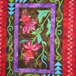 Wall Quilt Two Person/Group
Second Place
Fat Quarter Award - Thurman
Polygraph
Entered by:	Gayle Wilson
Pampa, TX
Made by:	Gayle Wilson, Connie Parks, Janie Van Zandant, Carol Hervey, Liza Harrison, Brenda Tucker
Quilted by: 	Gayle Wilson
Pattern by: 	Quilt Poetry
Size: 	52 x 39
Tropical Flowers