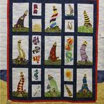 Appliqué Quilt Amateur	
Second Place
Fat Quarter Award - South Plains Quilters Guild
Entered by:	Lissa Andersen
	Midland, TX
Made by:	Lissa Andersen
Quilted by: 	Lissa Andersen
Pattern by:  	Nancy H. Barrett
Pattern Name: Lighthearted Lighthouses
Size: 	59  x 65
"Light" Houses